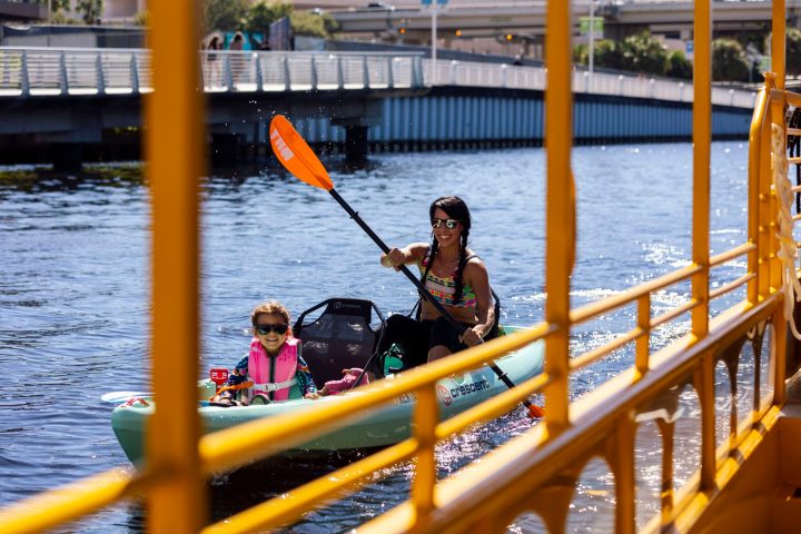 a group of people riding on the back of a boat