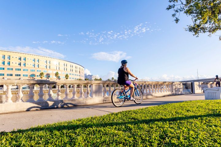 women riding a bike on Bayshore Blvd